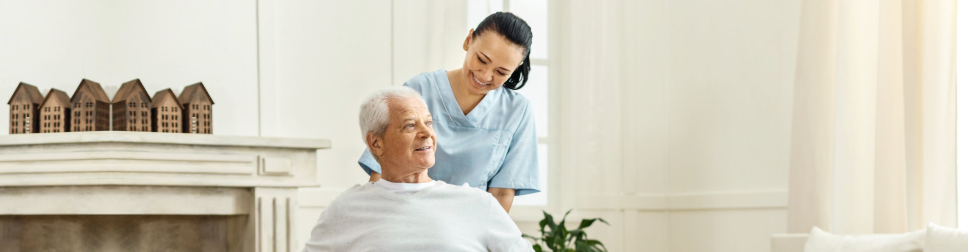 Caregiver giving an assistance to elderly man