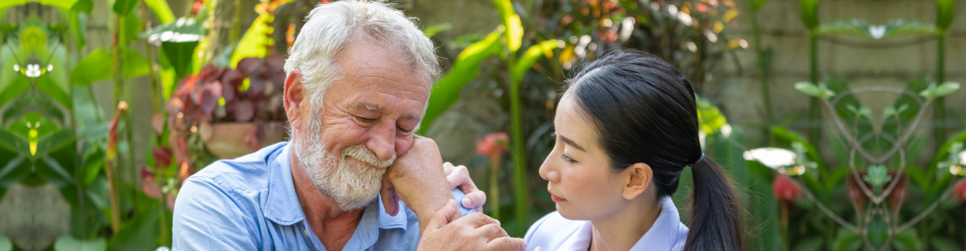 A female caregiver and an elderly man