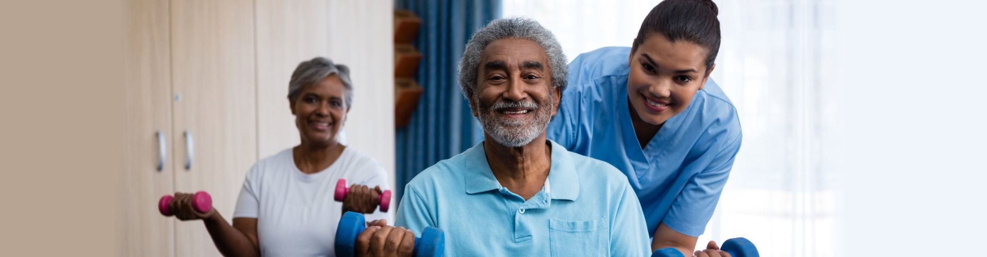 Female caregiver giving assisntane to senior citizens